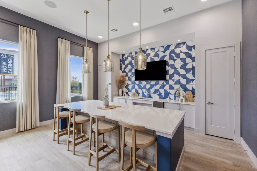 Modern clubhouse with elegant seating and large TV at Alta Grandway Apartments
