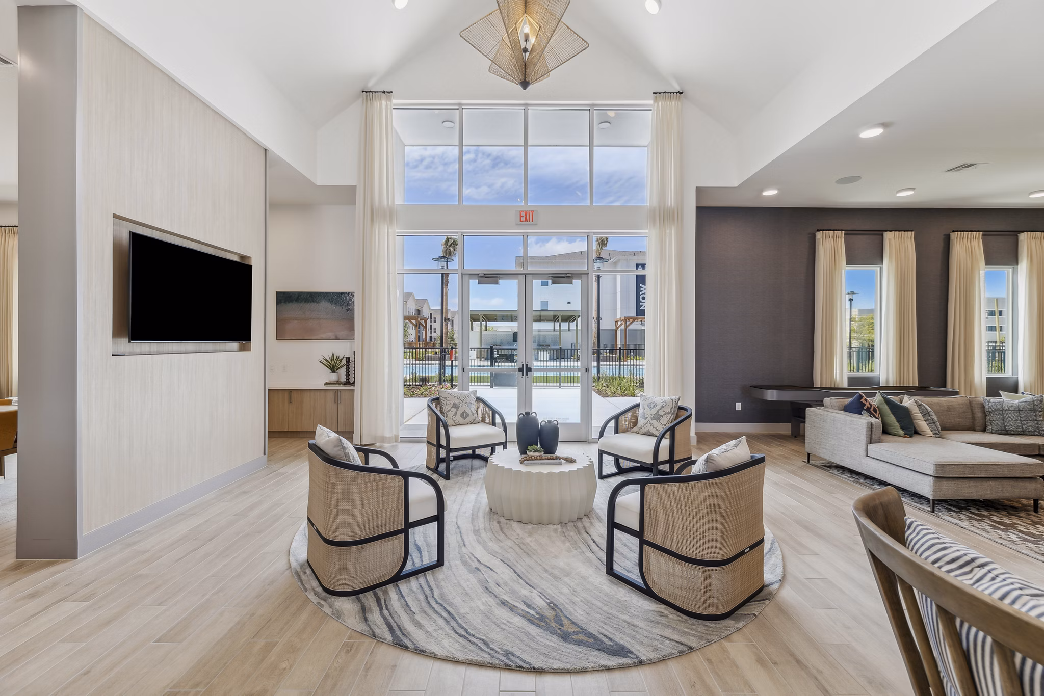 Modern clubhouse featuring spacious seating and pool table at Alta Grandway Apartments Ideal for social gatherings and relaxation
