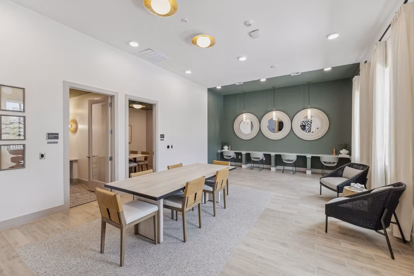 Clubhouse at Alta Grandway Apartments: Modern space featuring a lounge area, meeting rooms, and entertainment facilities