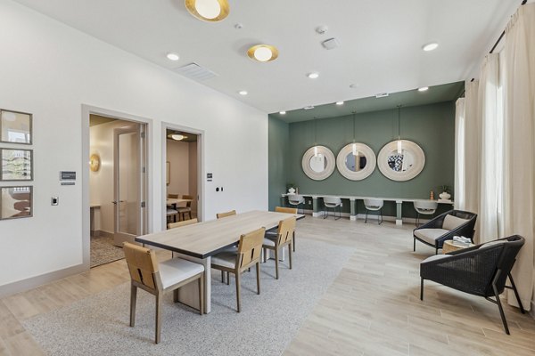 Clubhouse at Alta Grandway Apartments: Modern space featuring a lounge area, meeting rooms, and entertainment facilities