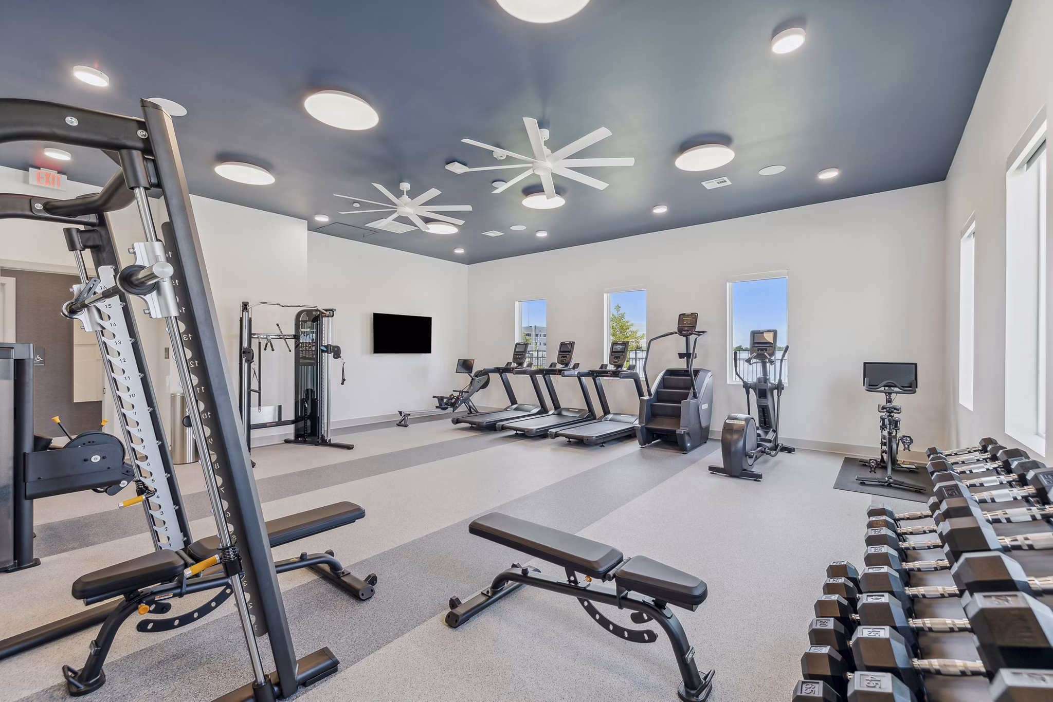 State-of-the-art fitness center with modern equipment at Alta Grandway Apartments