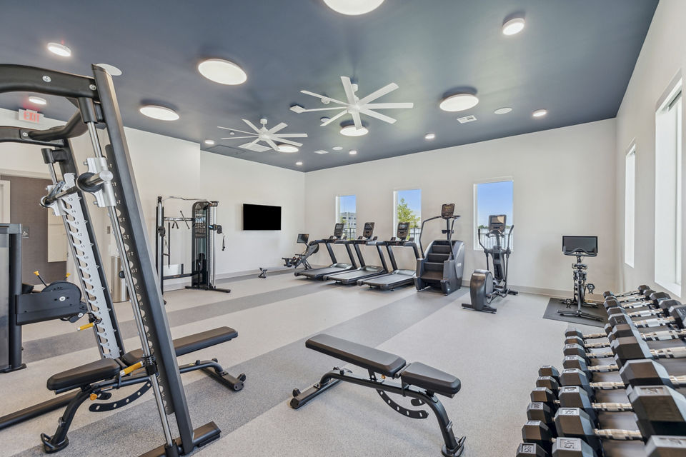 State-of-the-art fitness center with modern equipment at Alta Grandway Apartments