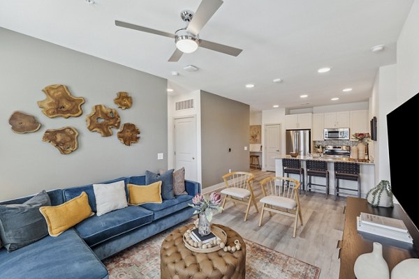 Alta Grandway Apartments: Cozy living room with modern furniture and natural light