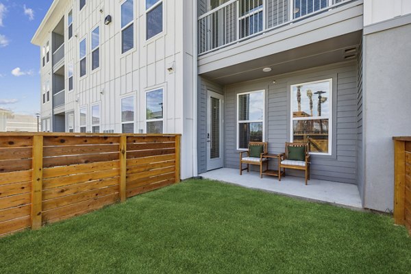 Inviting outdoor patio with seating at Alta Grandway Apartments