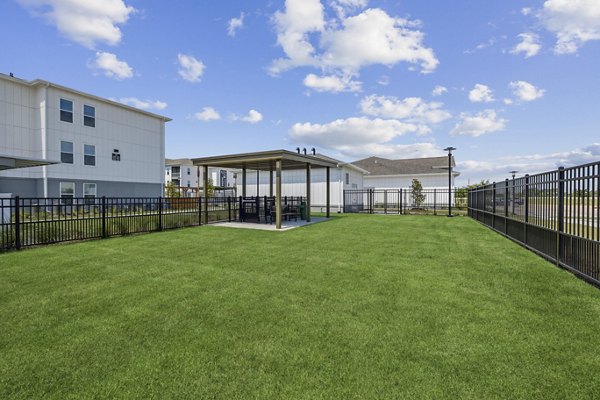 Dos Park: Scenic recreational park at Alta Grandway Apartments featuring walking trails and picnic areas