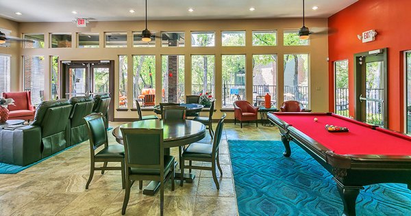 Clubhouse with cozy seating areas and community space at Wood Hollow Apartments