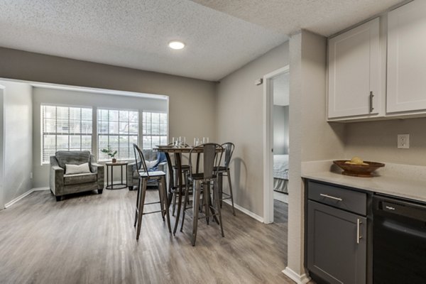 Dining area with modern furnishings in Wood Hollow Apartments