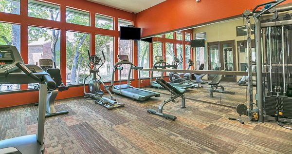 Fitness center with modern equipment at Wood Hollow Apartments, offering residents a state-of-the-art workout space