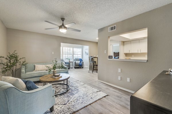 Spacious living room with contemporary decor at Wood Hollow Apartments