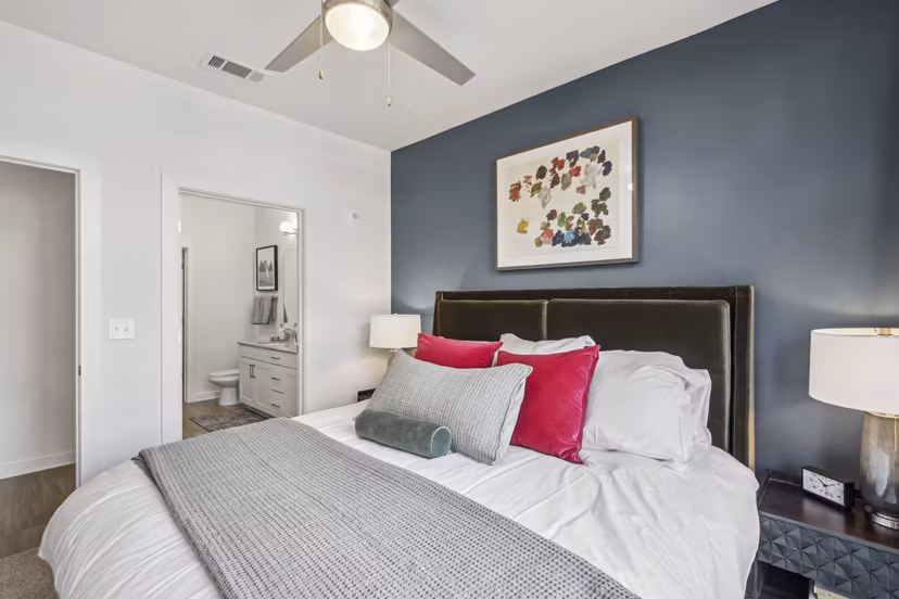 Modern bedroom with stylish decor at The Lacy at South Main Apartments