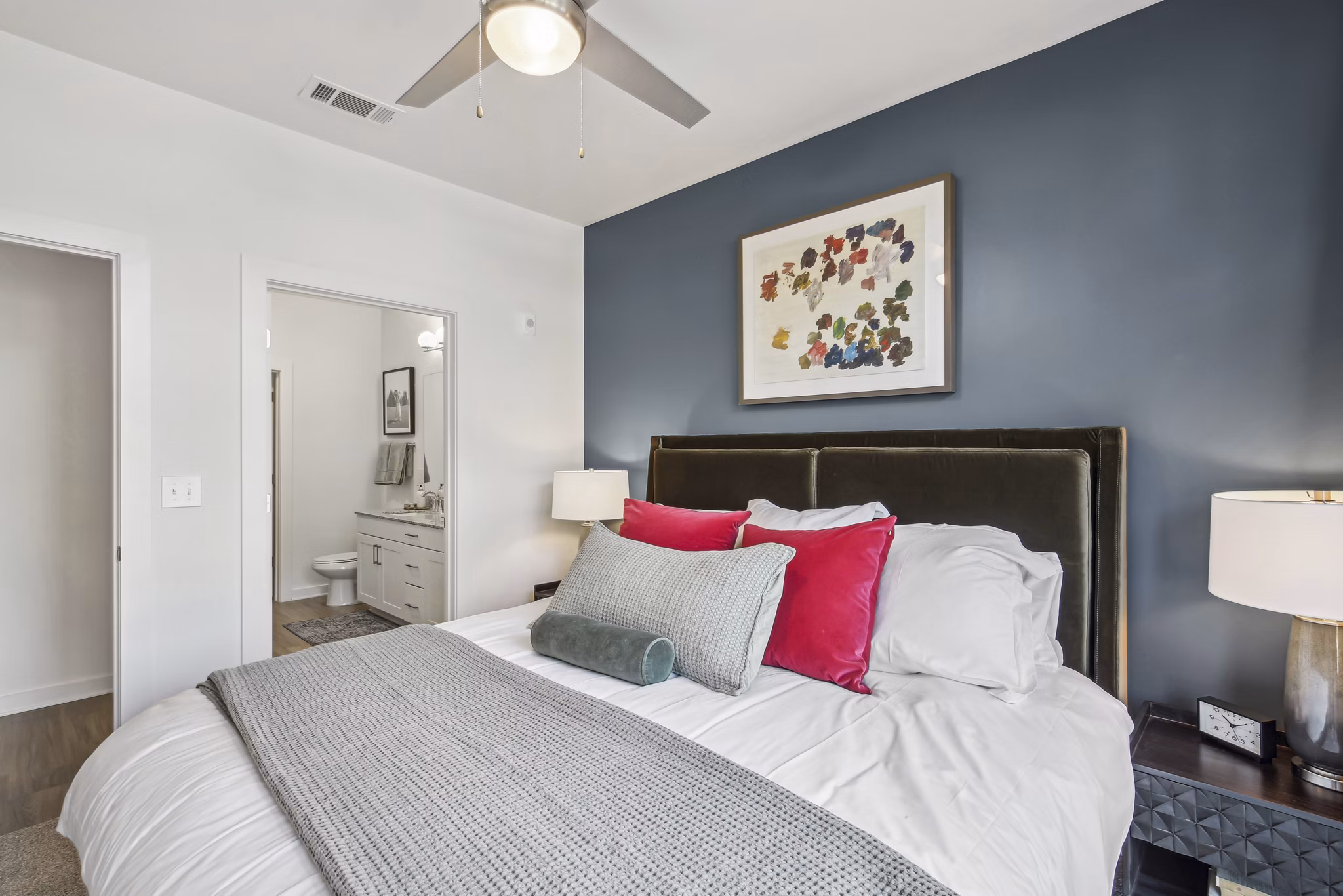 Modern bedroom with stylish decor at The Lacy at South Main Apartments