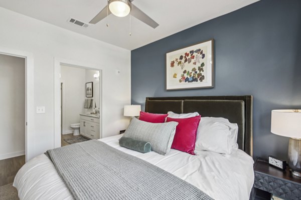 Modern bedroom with stylish decor at The Lacy at South Main Apartments