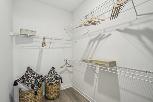 Walk-in closet with ample shelving and storage space at The Lacy at South Main Apartments