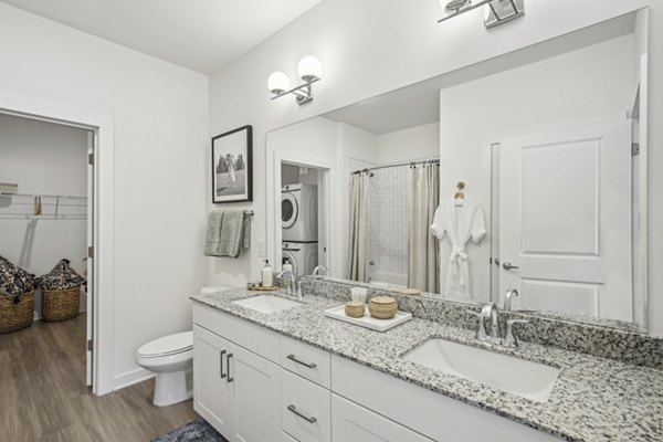 Elegant bathroom with modern fixtures at The Lacy at South Main Apartments