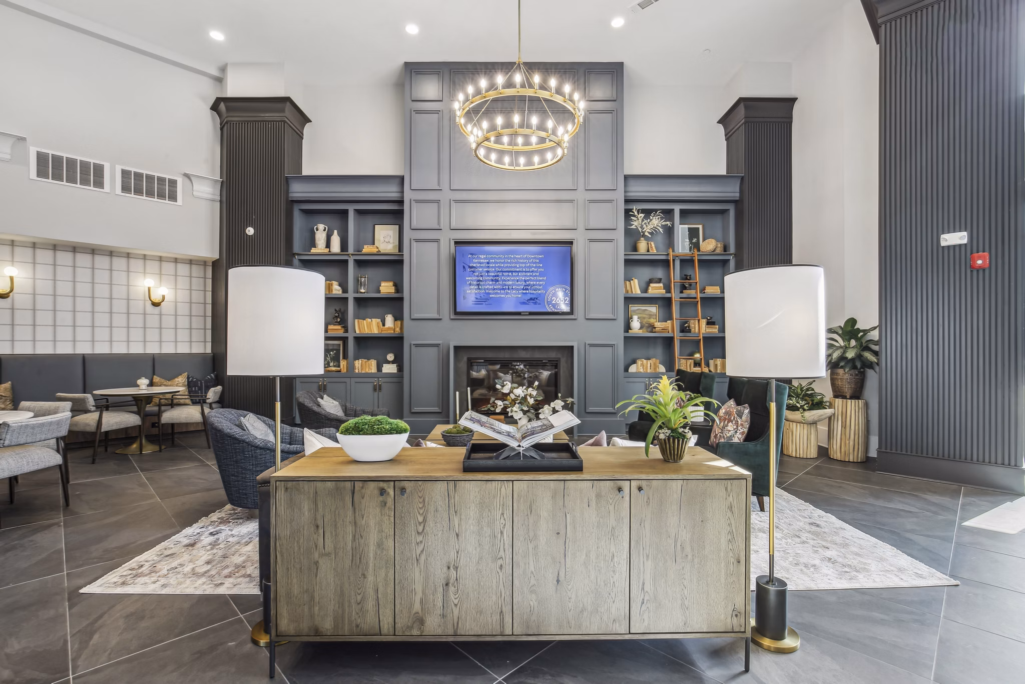 Clubhouse lounge with modern seating and decor at The Lacy at South Main Apartments