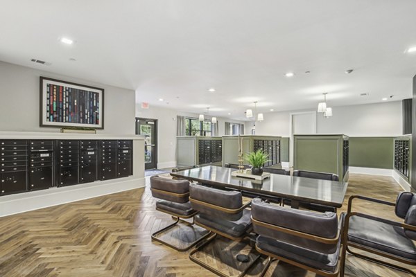 Home office with ergonomic chair and modern desk at The Lacy at South Main Apartments