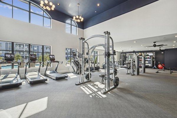 State-of-the-art fitness center with modern equipment at The Lacy at South Main Apartments