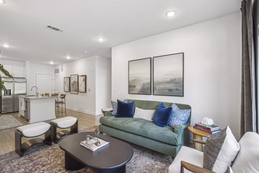 Spacious living room with modern decor in The Lacy at South Main Apartments