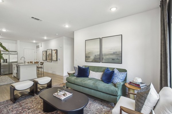 Spacious living room with modern decor in The Lacy at South Main Apartments