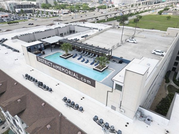 Modern pool at Regency Park Apartments featuring luxurious lounge chairs and landscaped surroundings, perfect for relaxation and leisure