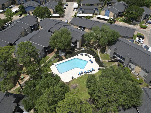 Pool with lounging deck at Regency Park Apartments, featuring luxury amenities for relaxation and recreation