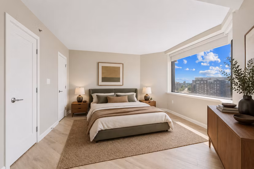 Bedroom featuring elegant decor and large windows at Marlowe Apartments, a luxury living space in a sought-after Greystar property