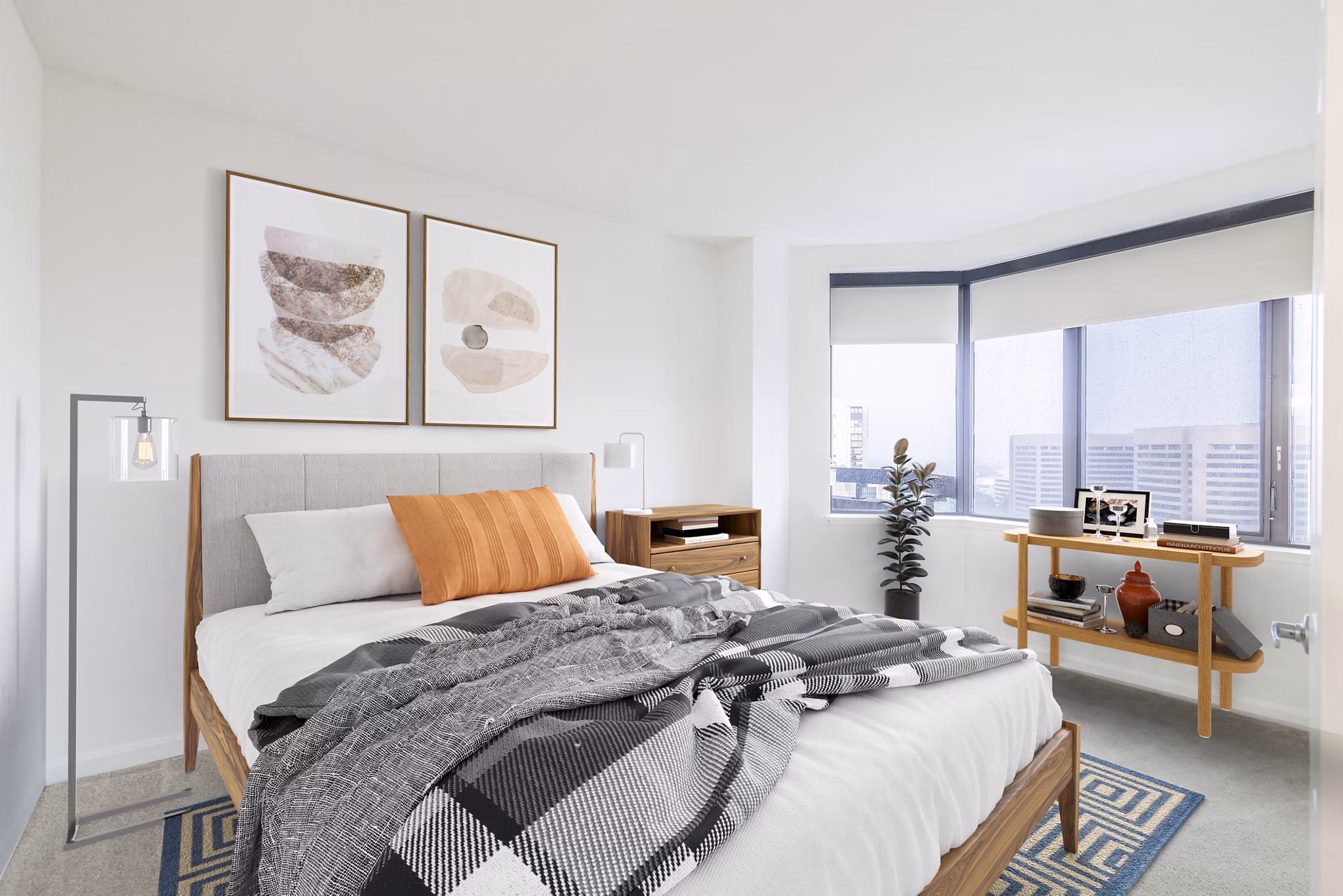Cozy bedroom with modern decor at Marlowe Apartments featuring luxury finishes and ample natural light, ideal for comfortable urban living