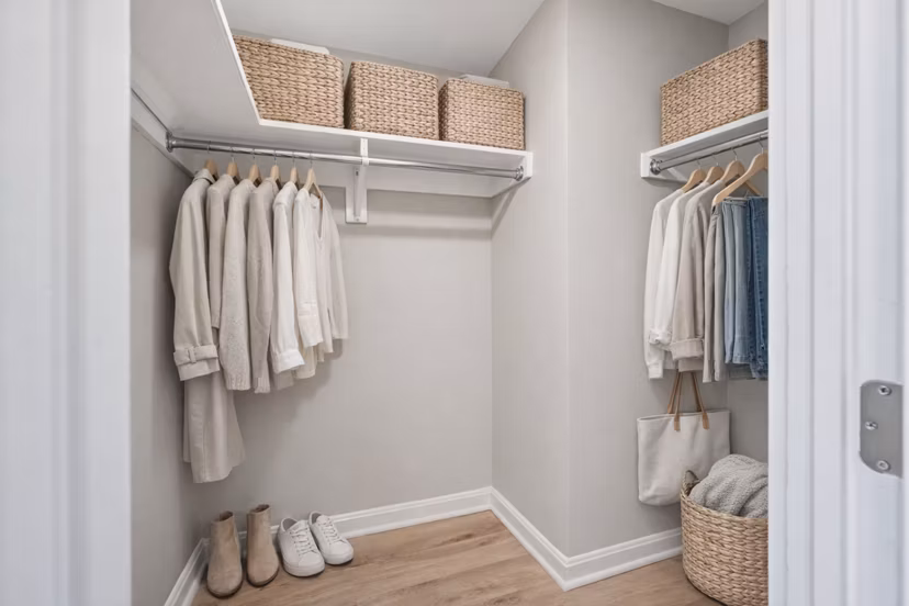 Cozy bedroom with stylish decor and large windows at Marlowe Apartments