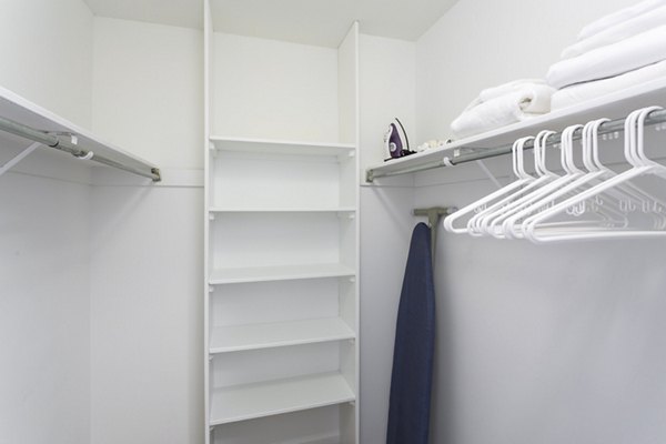 Walk-in closet with built-in shelving and ample storage in Marlowe Apartments luxury units