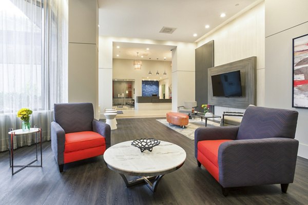 Elegant clubhouse with modern design at Marlowe Apartments, offering luxury amenities for residents to relax and socialize