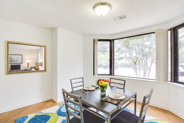 Dining room showcasing sleek furniture and modern lighting at Marlowe Apartments in luxury Greystar community