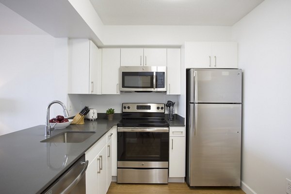 Modern kitchen with stainless steel appliances at Marlowe Apartments