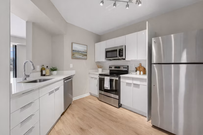 Modern kitchen with sleek cabinetry and stainless steel appliances at Marlowe Apartments