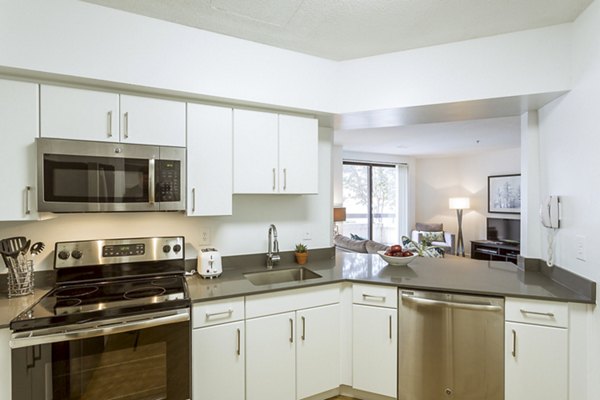 Kitchens featuring stainless steel appliances and granite countertops at Marlowe Apartments