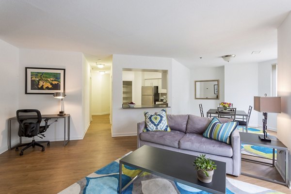 Spacious living room featuring modern furnishings and large windows in Marlowe Apartments