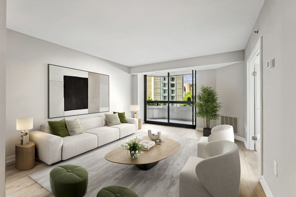 Spacious living room featuring modern furnishings and large windows in Marlowe Apartments