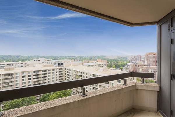 Marlowe Apartments: Private balcony with outdoor seating and city views, luxury living in a vibrant urban neighborhood