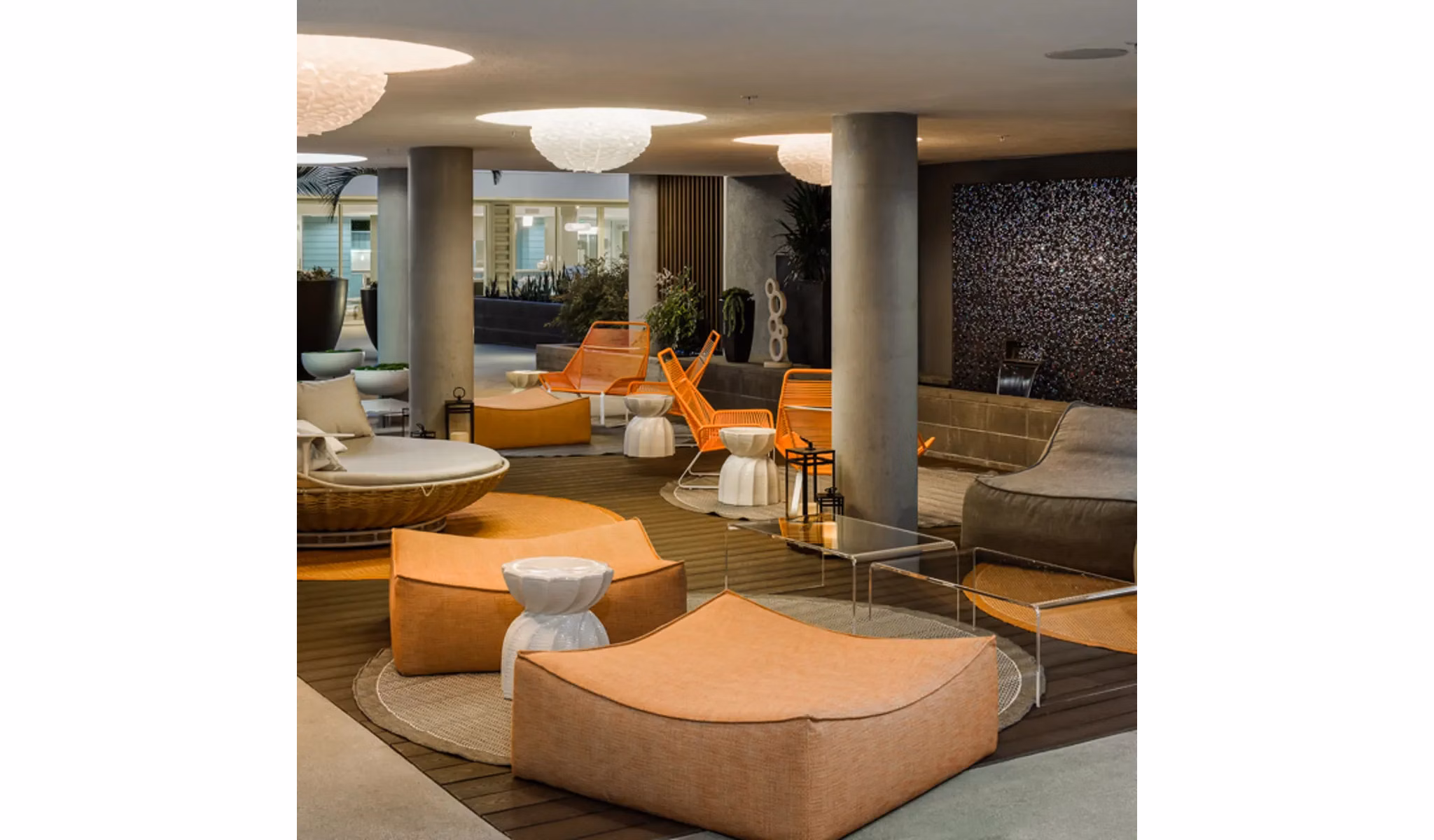 Stella Apartments: Inviting clubhouse with modern dÃ©cor and seating areas in luxury Greystar community