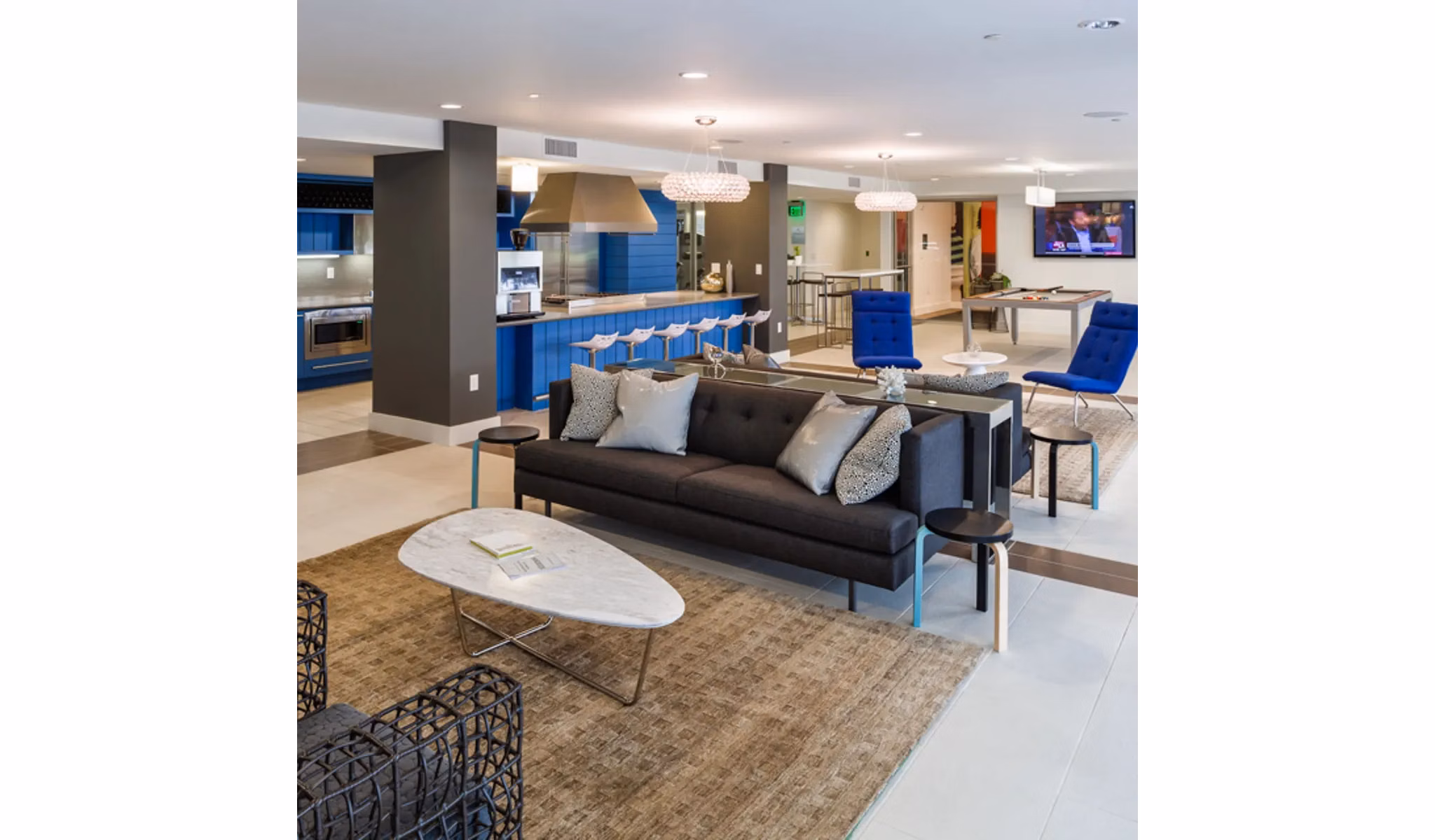 Clubhouse featuring modern lounge and entertainment spaces at Stella Apartments
