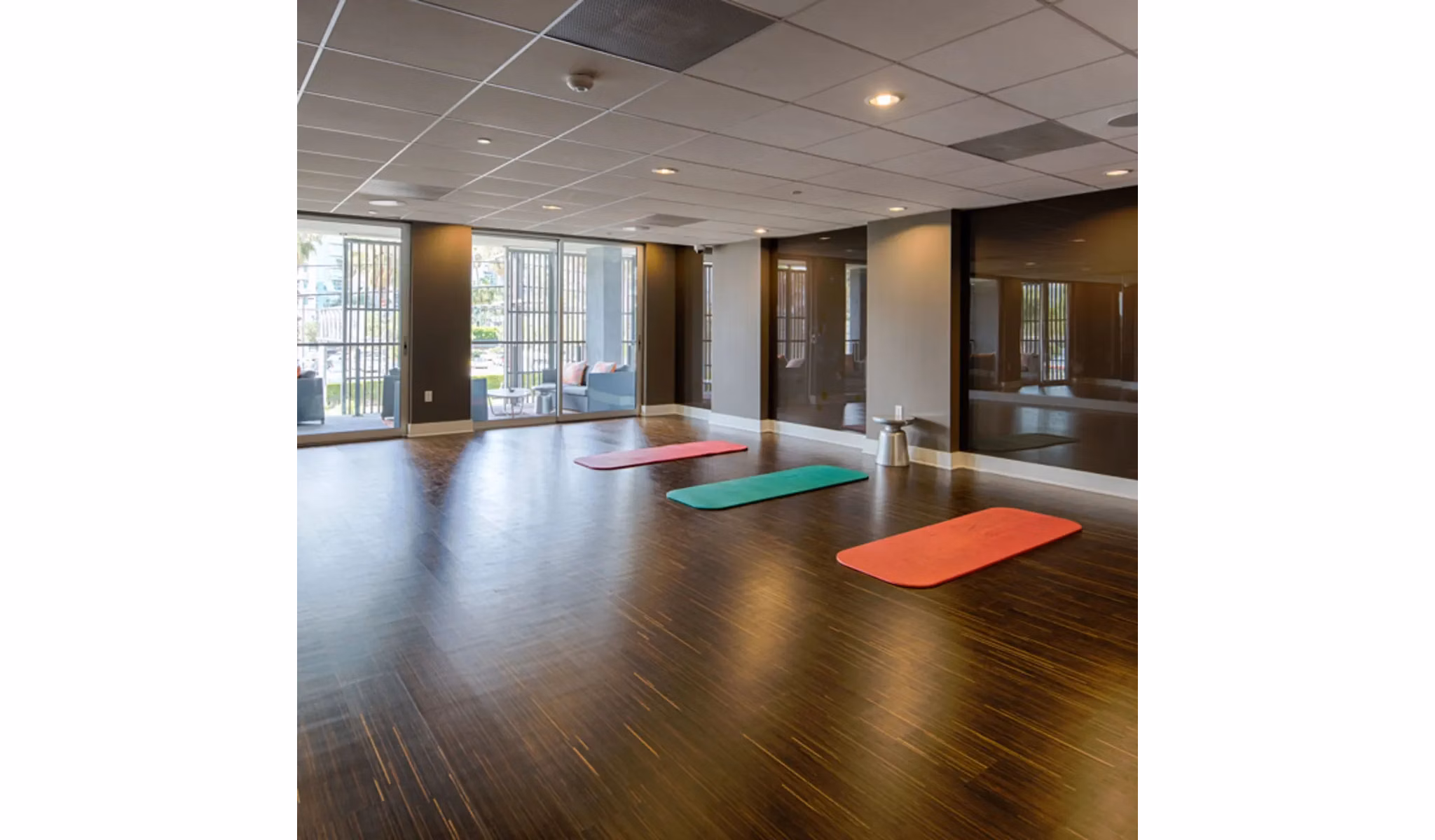 Yoga and spin studio at Stella Apartments with modern equipment and spacious layout for fitness enthusiasts