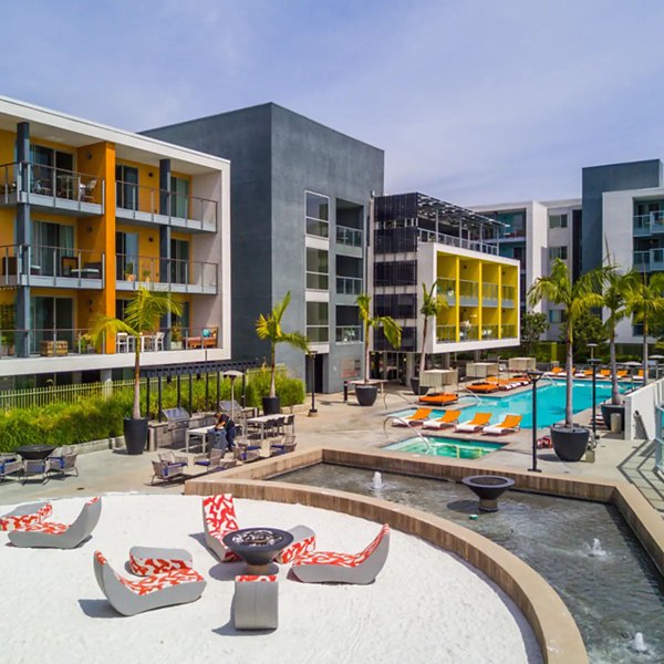 Stella Apartments: Tranquil courtyard with lush greenery and seating areas