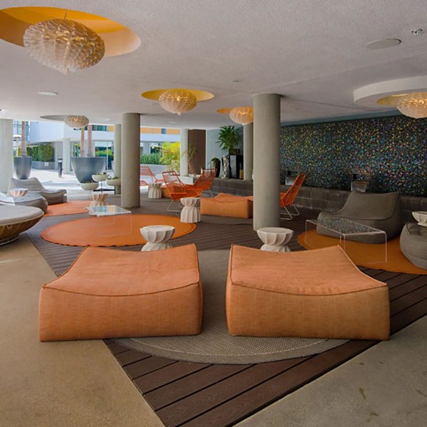 Stella Apartments: Lush courtyard with seating and greenery in a luxury apartment community