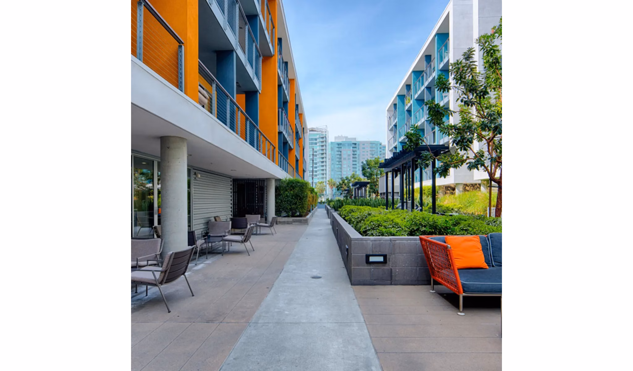 Spacious courtyard with lush gardens at Stella Apartments