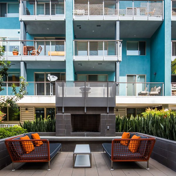 Open-air courtyard with lush landscaping at Stella Apartments, a luxurious property offering relaxing outdoor spaces
