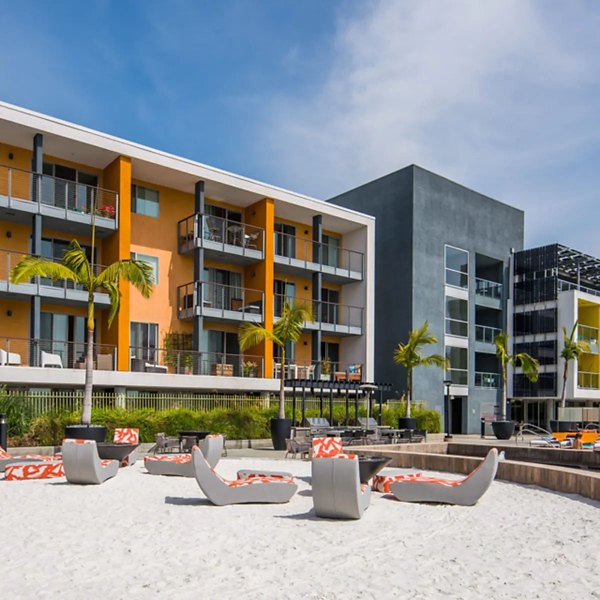 Stella Apartments: Serene courtyard with lush greenery and seating areas offering luxury living