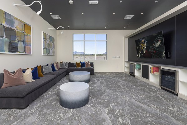 Clubhouse with modern furnishings and vibrant decor at Element 12 at Cadence Apartments