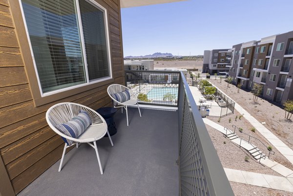 Patio with modern seating and city views at Element 12 at Cadence Apartments