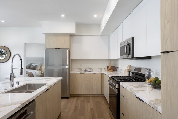 Modern kitchen with sleek countertops and stainless steel appliances in Unreal Engine Demo luxury apartments