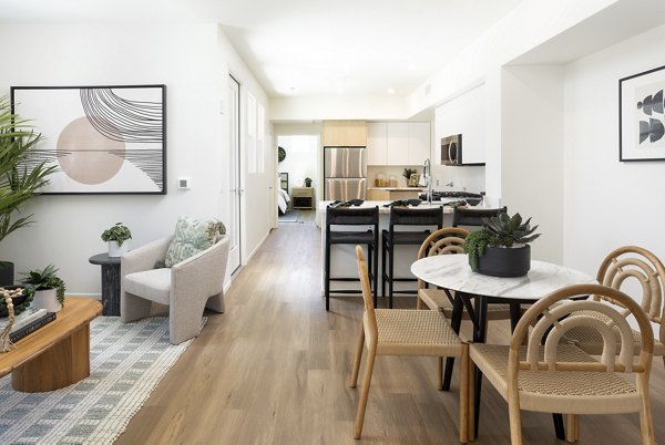 Spacious living room with stylish furnishings and natural light in luxury apartments