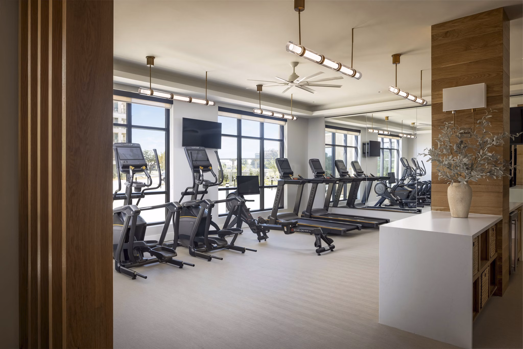 fitness center at The Mustang Apartments 